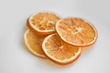 Slice of orange close up on white background