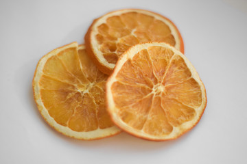 Slice of orange close up on white background