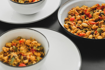 Mutiple morroccan couscous dishes at the table with vegetables 
