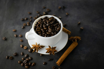 Coffee with beans on dark background
