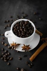 Coffee with beans on dark background