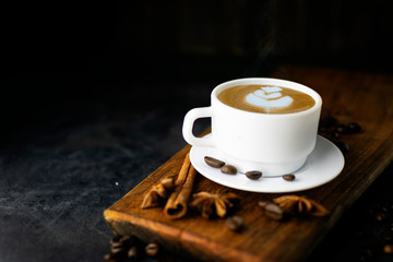 Coffee with beans on dark background