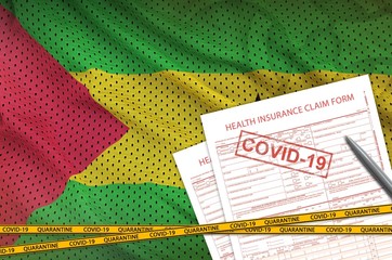 Sao Tome and Principe flag and Health insurance claim form with covid-19 stamp. Coronavirus or...