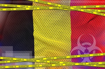 Belgium flag and Covid-19 quarantine yellow tape. Coronavirus or 2019-nCov virus concept