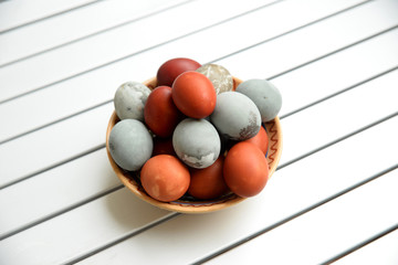 Easter eggs colored in grey and red.