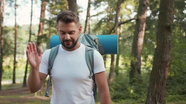 Young Man with beard and backpack use phone around blue animation сloud technology internet networking device online storage computing icon network connection virtual interface digital marketing slow