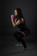 Woman boxer training hard.