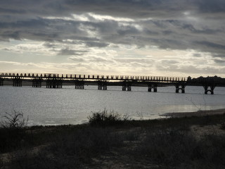 Fototapeta na wymiar Puente Punta del Caiman dia nuboso Isla Cristina Huelva Andalucía España