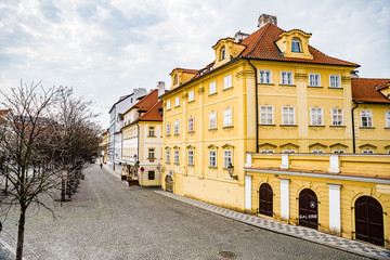 Prague, Czech republic - March 19, 2020. Street Na Kampe by Charles Bridge without tourists during coronavirus travel ban