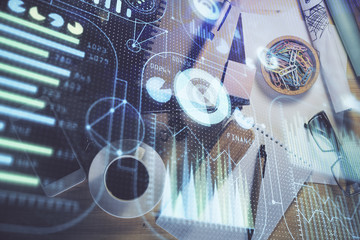 Double exposure of technology theme drawing over work table desktop. Top view. Global data analysis concept.