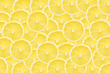 Lemon slices background. Yellow fruit cut texture. Citrus section pattern. Vibrant color summer design.