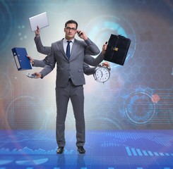 Young businessman in multitasking concept