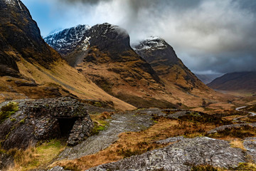 Glencoe, Scotland - Jan 2020: Bothy shelter at the base of the 3 sisters as a winter storm passes overhead