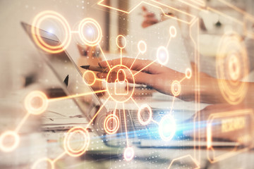 Double exposure of woman hands typing on computer and social network theme hologram drawing. People media concept.