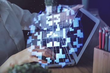 Double exposure of woman hands working on computer and data theme hologram drawing. Tech concept.