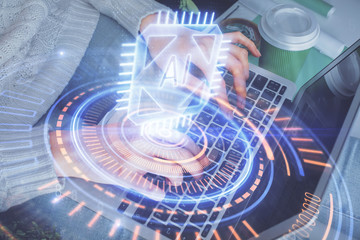 Double exposure of woman hands working on computer and data theme hologram drawing. Tech concept.