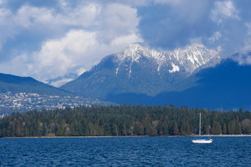 Yacht with mountain in the background, Vancouver, Canada