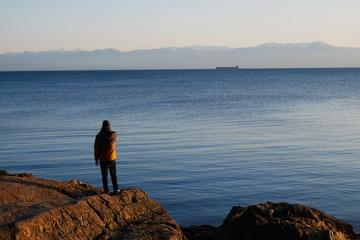 Fototapeta na wymiar Man admiring view across to Olympic National park
