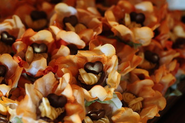close up of heart shaped chocolate candy,  condensed milk candy balls, chocolate truffles, brigadeiro, chocolate sprinkles, chocolate candy