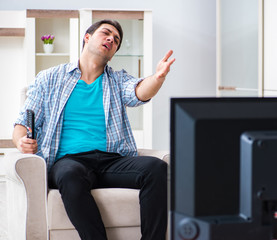 Man watching tv at home