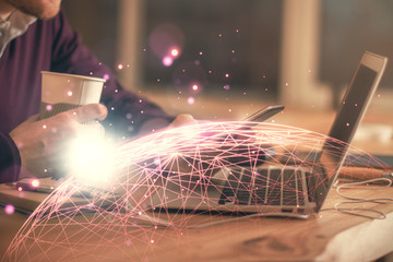 Double exposure of man's hands holding and using a phone and social network theme drawing.