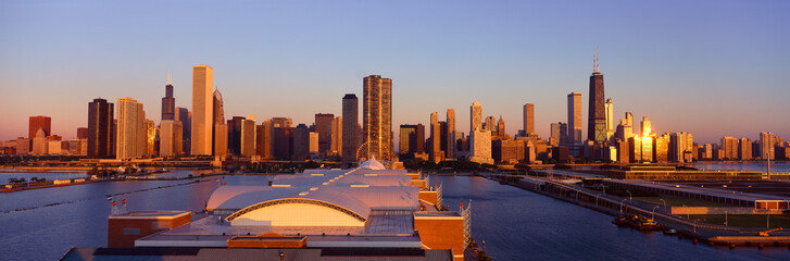 Panoramic view of Navy Pier and Chicago skyline at sunrise, Chicago, IL