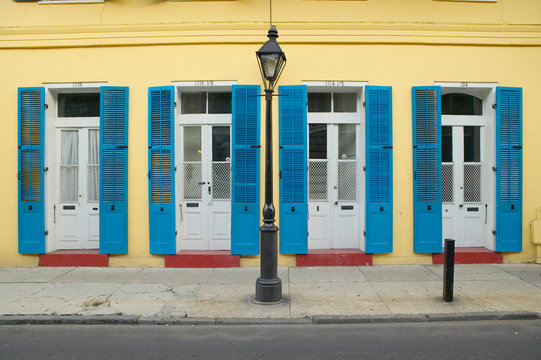 Blue shutter and lamp post in French Quarter near Bourbon Street in New Orleans, Louisiana