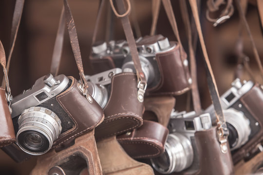 Vintage analog cameras in leather cases