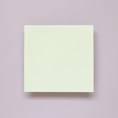 Obraz na płótnie Canvas White memo pad, empty paper on purple background. top view, copy space