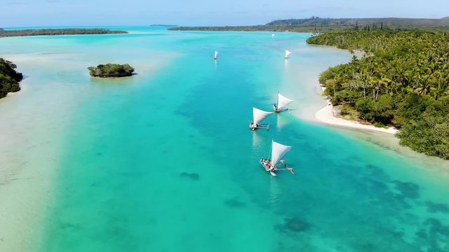 The bay of Upi in New Caledonia with the typical boats of the Kanak people. Isle of Pines.