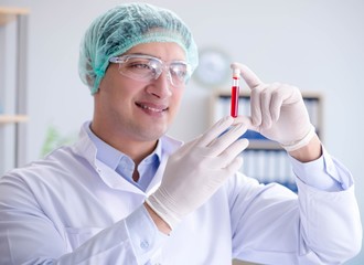 Blood testing in the lab with young scientist