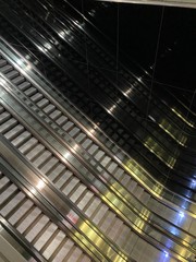 Obraz premium escalator in business center, escalator at train station, escalator at the undergroud, subway, metro station, stainless steel, upstairs, picture from upstairs