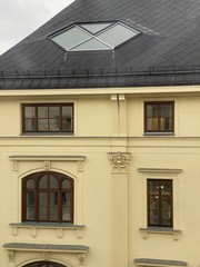 Obraz premium tenement, apartment house, old building, yellow facade, dormer window