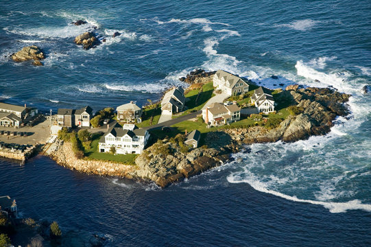 Aerial view of ocean-front homes on Perkins Cove, on coast of Maine south of Portland