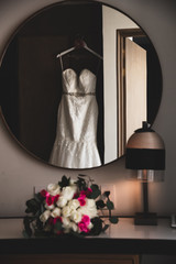 Wedding dress or bridal gown which is the dress worn by the bride during a wedding ceremony.