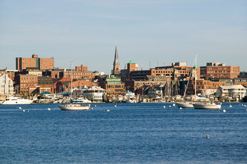 Fototapeta na wymiar View of Portland Harbor boats with south Portland skyline, Portland, Maine