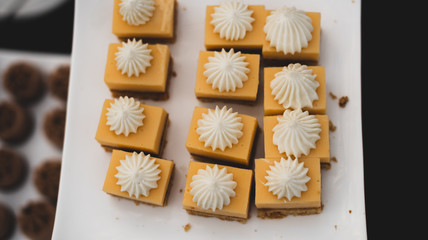 Obraz na płótnie Canvas Top View of delicious individual square cupcakes