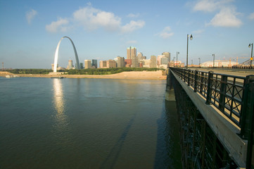 Gateway Arch and skyline of St. Louis, Missouri at sunrise from bridge in East St. Louis, Illinois on the Mississippi River