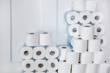 Large stack of toilet paper rolls in a home. Home preparedness for emergency situations. Stocking...