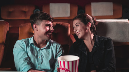 People audience watching movie in cinema theater.