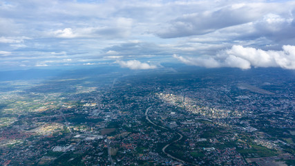 Obraz premium Skyscape view from clear glass window seat from aircraft to cloudscape, traveling on white fluffy clouds and vivid blue sky above the earth in a sunny day