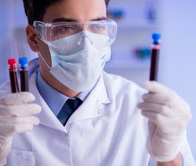 Lab assistant testing blood samples in hospital