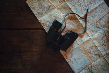 old map and binoculars