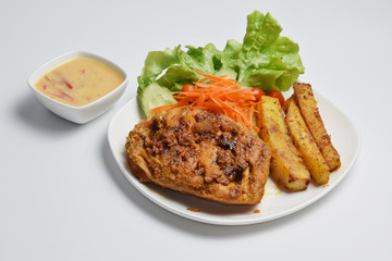 Backed chicken with spices and backed potato.