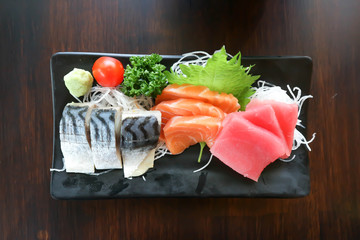 raw salmon and raw tuna or sashimi and grilled salmon