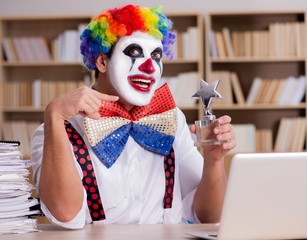 Clown businessman working in the office