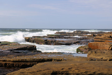 Waves Breaking on Susan Gilmore Beach at Low Tide