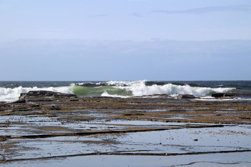 Waves Breaking on Susan Gilmore Beach at Low Tide
