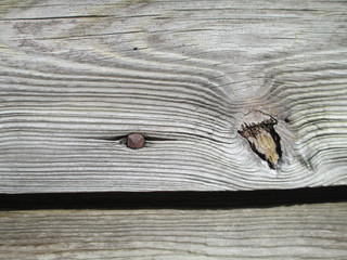 wood with square rusted nail