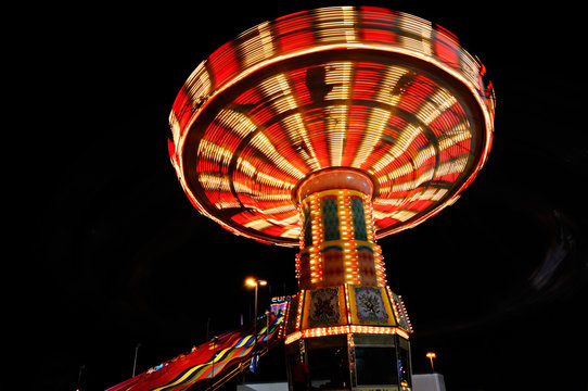 Red And White Light Streaks At Night From The Swing Ride At The Toronto CNE